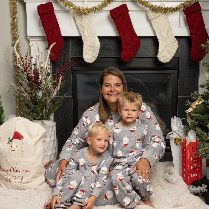 Mother and sons wearing Gray Santa with traditional Santa sack