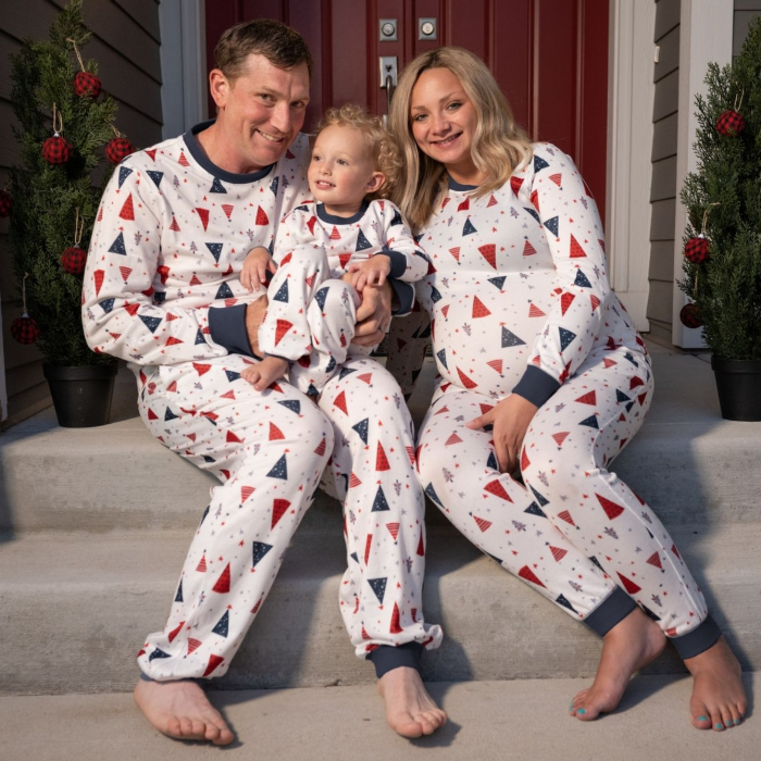 Family wearing white tree sitting on front porch step