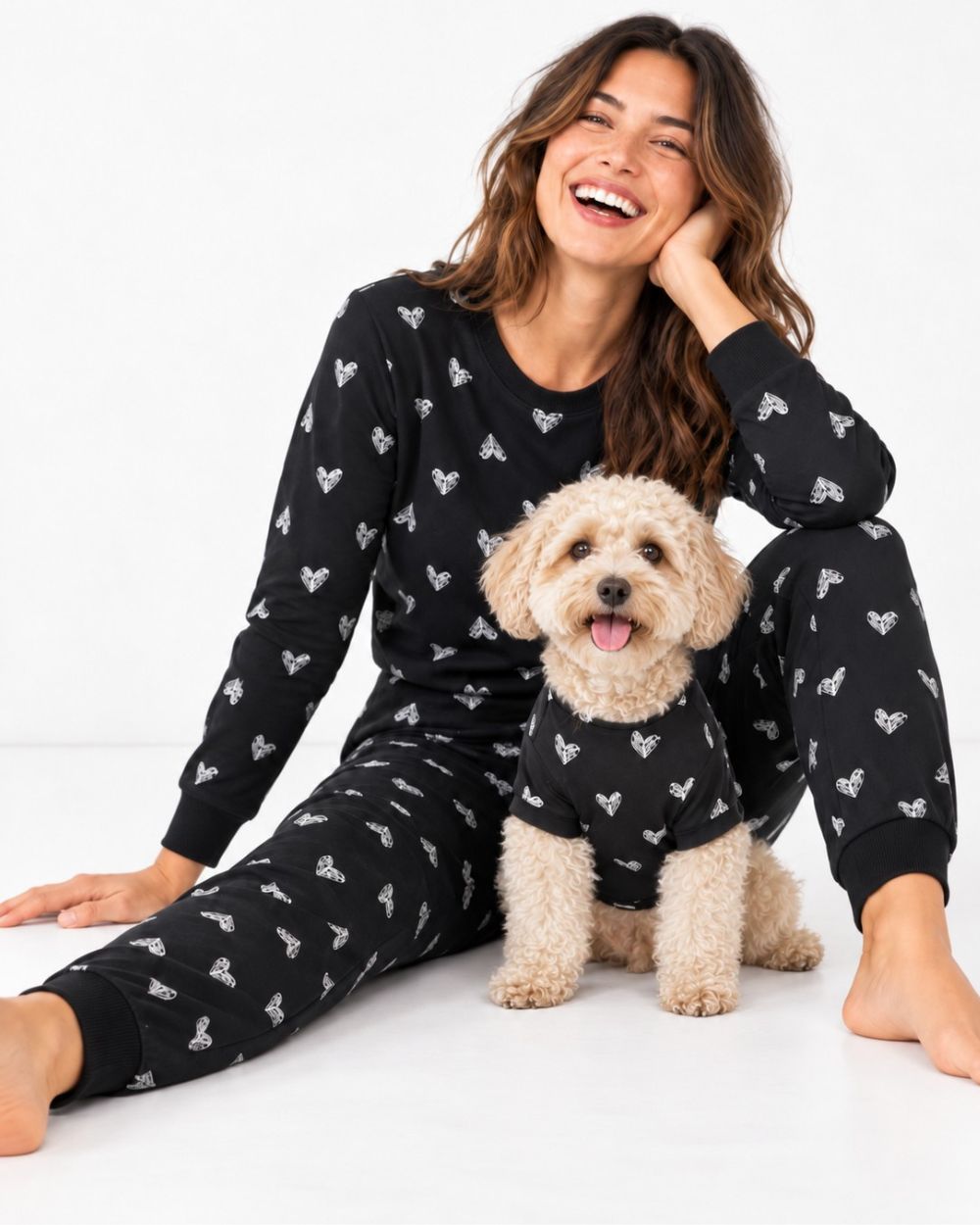 Woman and her dog in matching pajamas and pet tee