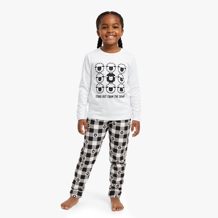 kid wearing white stand out shirt black sheep pant