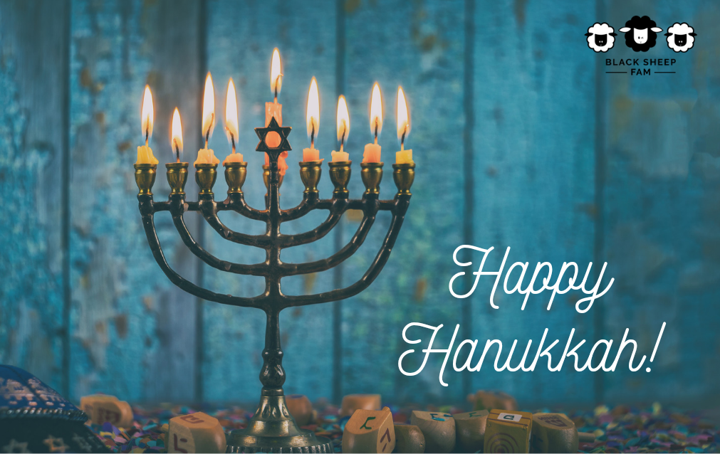gift card saying Happy Hanukkah on blue with a lit menorah