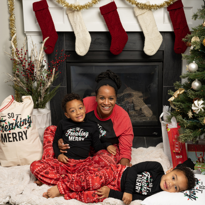 family wearing red fair isle pants and so freaking merry shirts