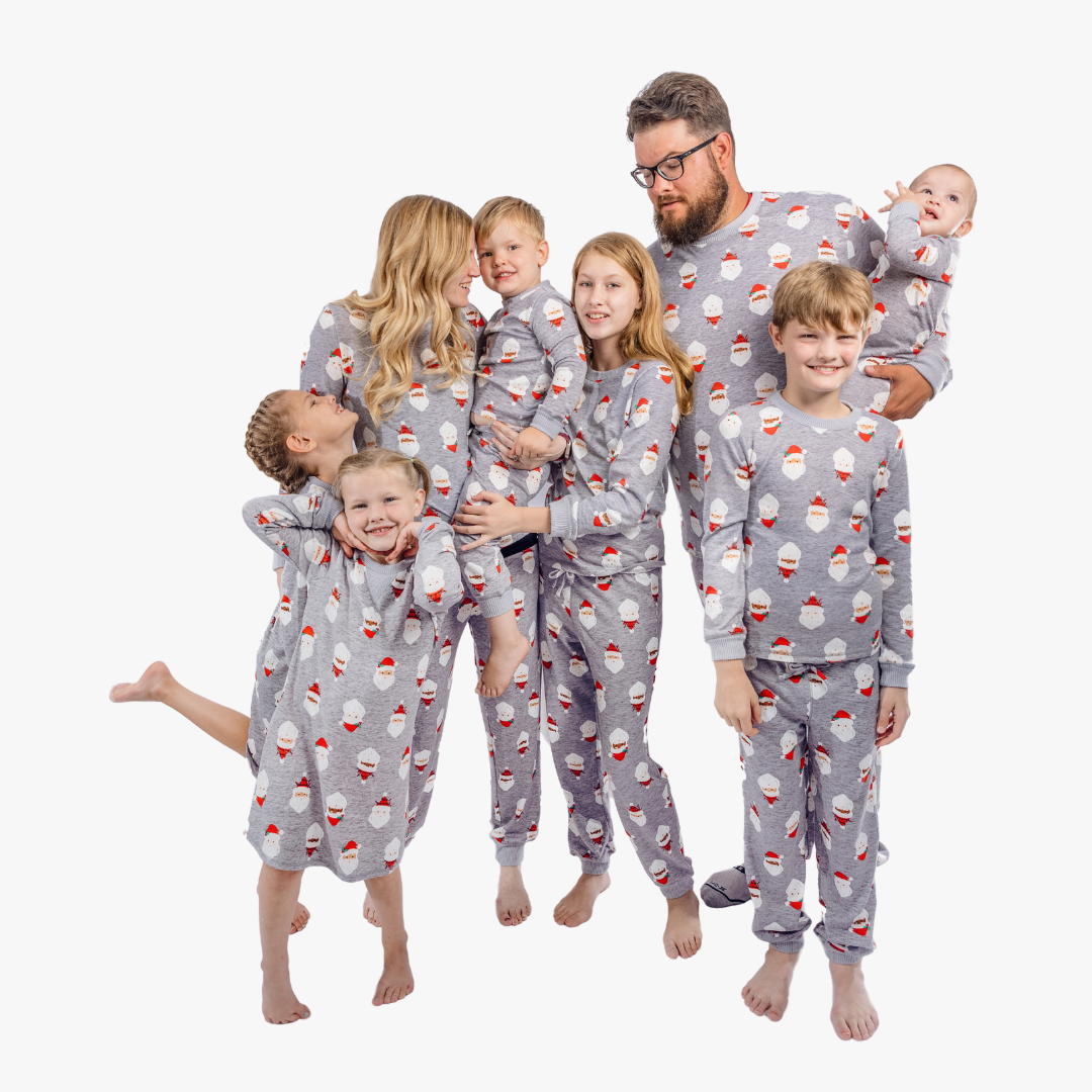 large family wearing gray santa pajamas 