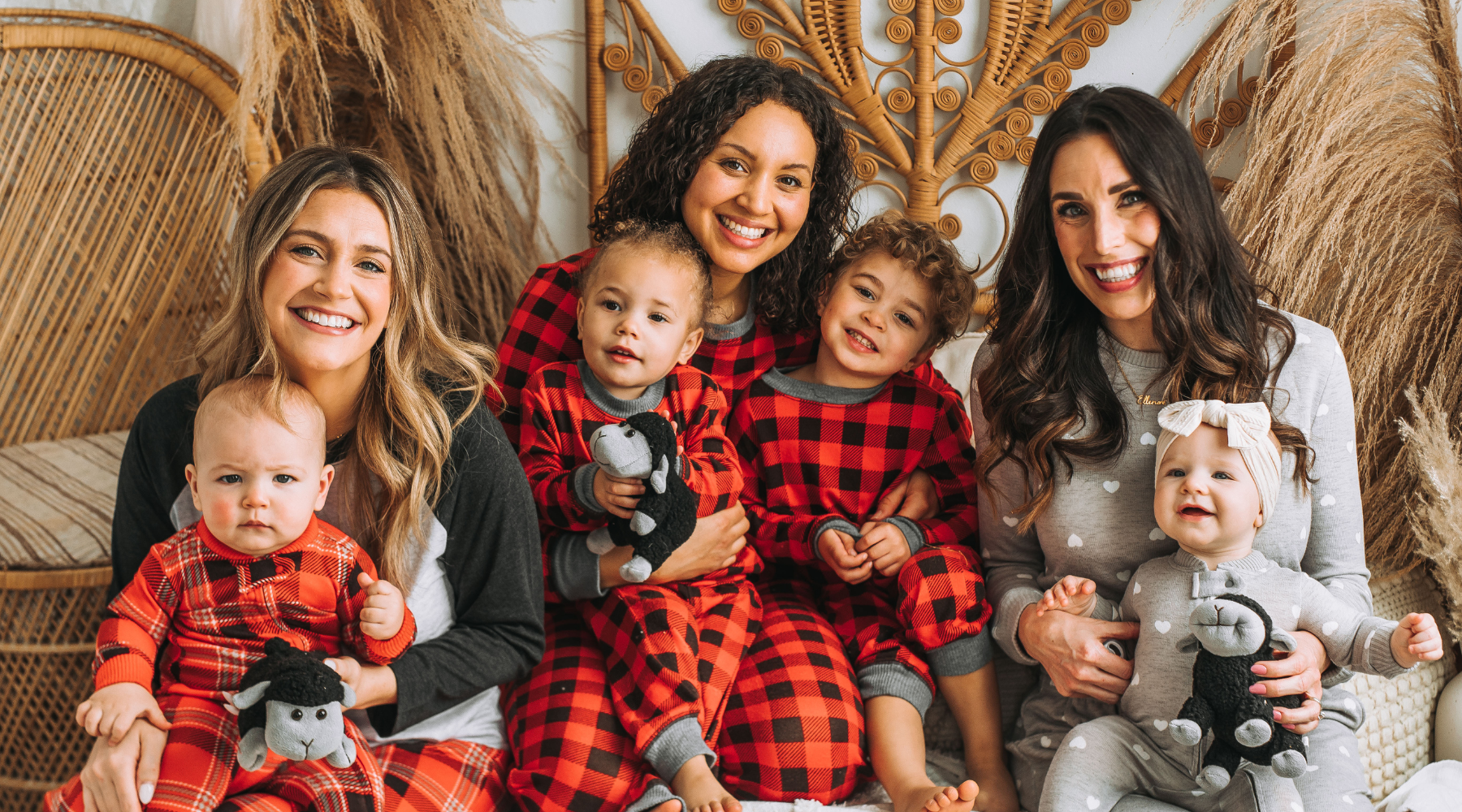 Mothers and children in red plaid, red buffalo and gray hearts pajamas