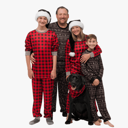 family wearing red black buffalo and black fair isle with dog in bandana
