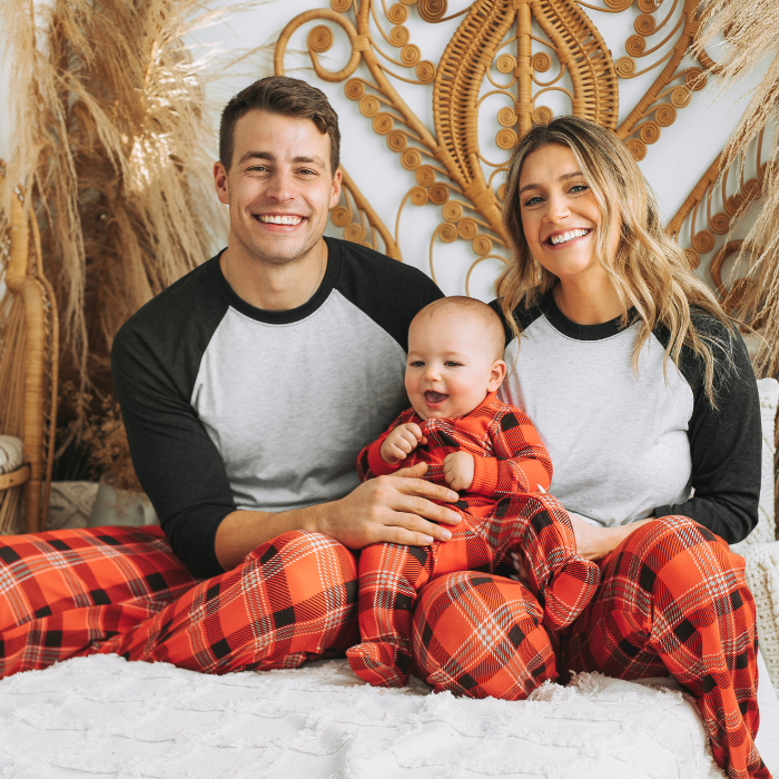 Black Sheep Fam family wearing Red Plaid and mom and dad in white and black solid raglan shirts