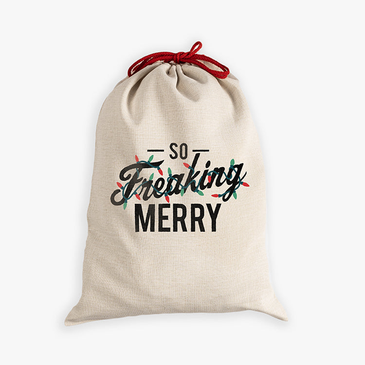 Natural canvas santa sack with So Freaking Merry strung with multi colored lights and red drawcord