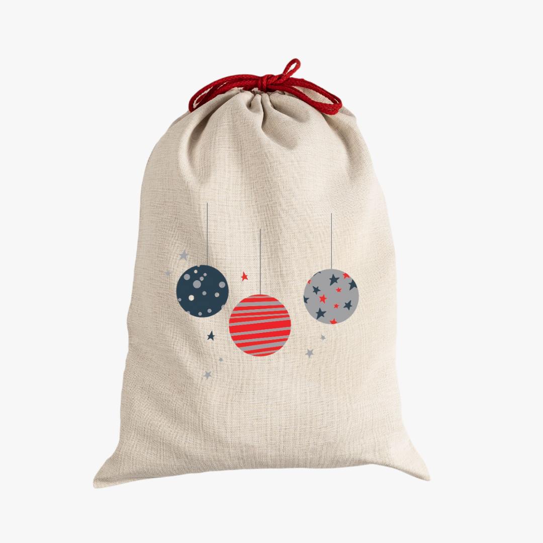 Natural canvas santa sack with ornaments in navy, red and gray with red drawcord