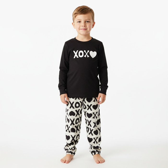kid wearing black xoxo shirt white black xoxo pant